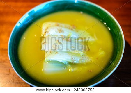 Seasonal White Bok Choy Cabbage Cooked In  A Duck Bouillon Served In Porcelain
