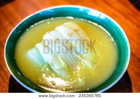 Seasonal White Bok Choy Cabbage Cooked In  A Duck Bouillon Served In Porcelain