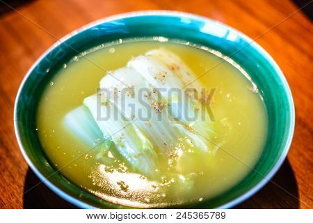 Seasonal White Bok Choy Cabbage Cooked In  A Duck Bouillon Served In Porcelain
