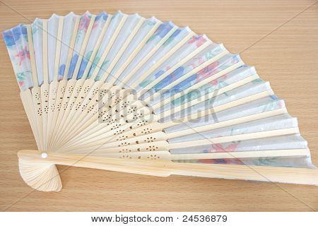 Paper Fan Lie On A Table