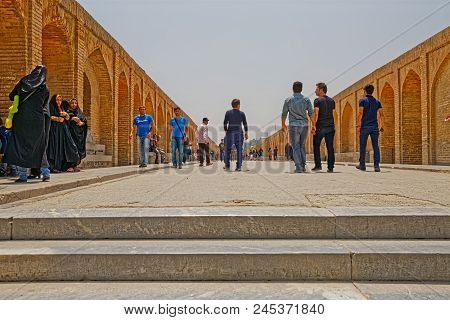 Isfahan, Iran - May 8, 2015: People At Promenade Enjoying The View Of The Zayandeh River From The An