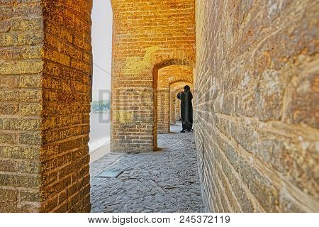 Isfahan, Iran - May 8, 2015: People Resting And Enjoying The View Of The Zayandeh River From The Anc