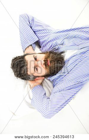 Man With Strict Face Wake Up, Lay On Bed, Put Hands Behind Head, Top View. Hipster With Beard, Musta