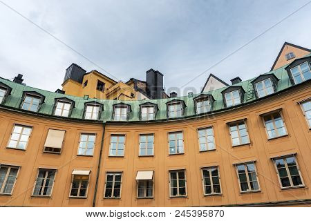 View At The Orange Walls Of A Building In Old Part Of A European Town. Building In The Center Of Sto