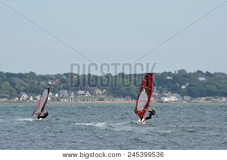 Two Windsurfers Off Lepe Beach In The Solent