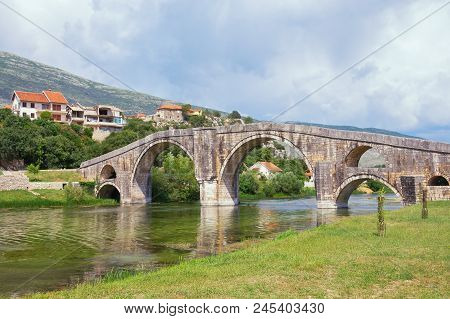 Ancient Stone Bridge. Bosnia And Herzegovina, Trebinje. View Of Arslanagic Bridge Over Trebisnjica R