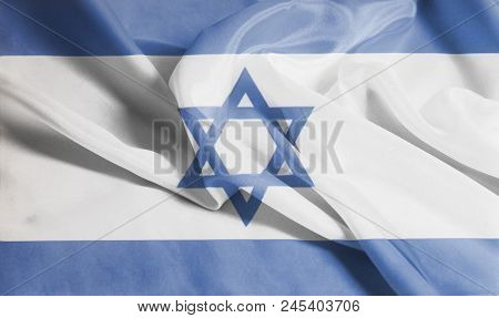 Rippled Waving Flag Of Israel Background Close Up .