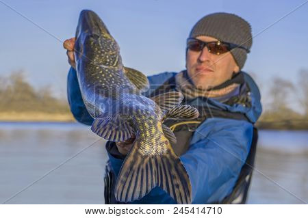 Fishing. Happy Fisherman With Big Pike Fish Trophy
