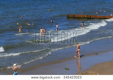 Zelenogradsk, Kaliningrad Region, Russia - July 29, 2017: Unknown People Bathing The Baltic Sea Wate