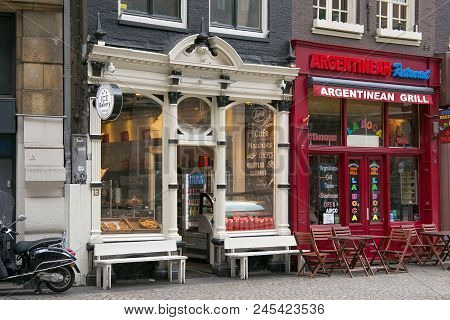Amsterdam, Netherlands - June 25, 2017: Storefronts Of The Ice Bakery Cafe And Argentinean Steakhous