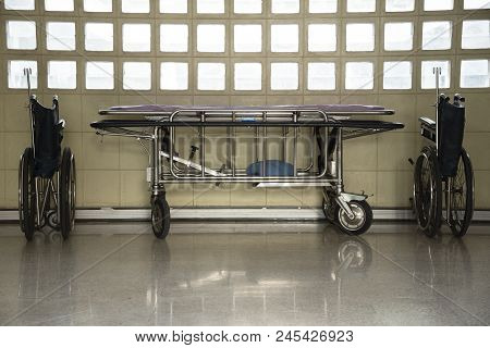 Two Wheelchairs And A Stretcher Troller Parking In The Building