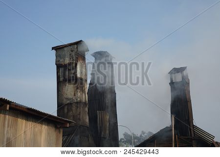 Smoky Chimney Of The Traditional Smoking Fish  Factory In Semarang, Indonesia