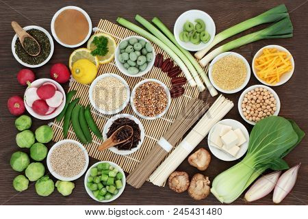 Macrobiotic diet food with japanese udon and sobu noodles, kuchika tea, tofu, miso and wasabi paste, legumes, grains and vegetables, foods high in protein, fibre, antioxidants, minerals and vitamins. 