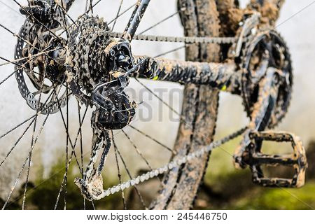 Mountain Bike Transmission In Mud. Dirty Chain Drive Of Mountain Bike After Riding In Bad Weather