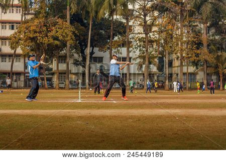 Men Playing Cricket With Tennis Ball At Mumbai Grounds