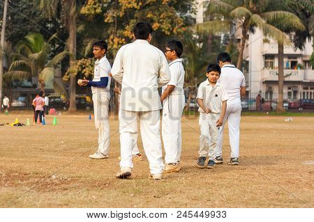 Indian Kids Practicing At Cricket Net To Improve Cricketing Skills
