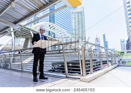 Asian Business And Engineer Man Has Planning And Working For Design Buiding And City.