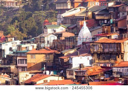 Shimla, India - 27th Apr 2018:triangular Roof Of A Hindu Temple In The Middle Of Brown Concrete Buil