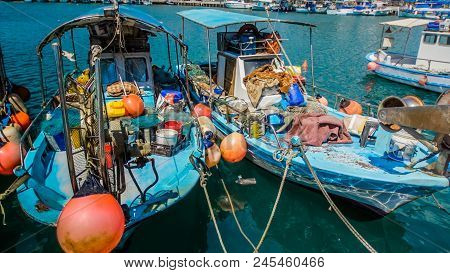 The Old Fishing Boats Are Waving On The Waves. Shipyard  In Limassol, Cyprus,  August 2017