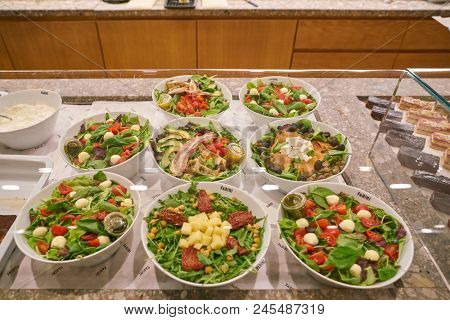 MILAN, ITALY - CIRCA NOVEMBER, 2017: salads on display at Farini in Milan. Farini is modern bakery which offers Italian pastry, salads, bowls and pizza