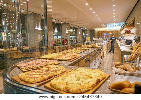 MILAN, ITALY - CIRCA NOVEMBER, 2017: food on display at Farini in Milan. Farini is modern bakery which offers Italian pastry, salads, bowls and pizza