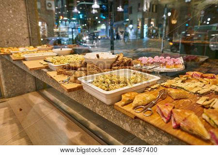 MILAN, ITALY - CIRCA NOVEMBER, 2017: food on display at Farini in Milan. Farini is modern bakery which offers Italian pastry, salads, bowls and pizza