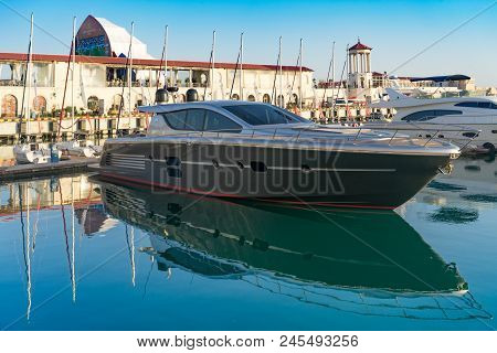 Sochi, Russia-june 14, 2018: Sea Port With Yacht Parking On The Background Of The Multimedia Screen 