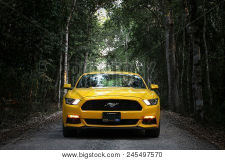 Xpujil, Mexico - May 19, 2017: Yellow Muscle Car Ford Mustang At The Countryside.