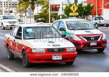 Campeche, Mexico - May 20, 2017: Taxi Cars Nissan Tsuru And Nissan Versa In The City Street.
