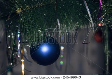 Blue Fur-tree Toy On A Christmas Tree On A Background Of Decoration