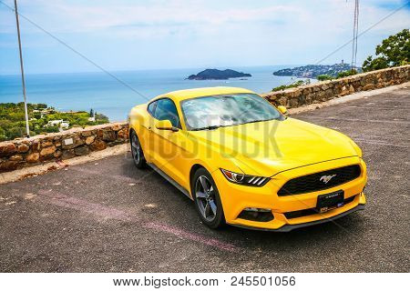 Acapulco, Mexico - May 31, 2017: Yellow Muscle Car Ford Mustang In The City Street.