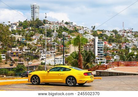Acapulco, Mexico - May 31, 2017: Yellow Muscle Car Ford Mustang In The City Street.