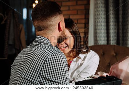 A Couple Dinners In A Restaurant A Man Kisses A Woman, Romantic Young Couple At Restaurant