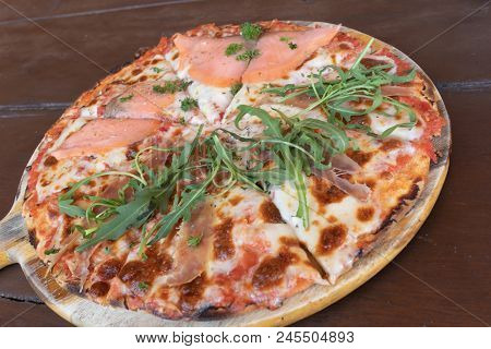 Delicious Baked Italian Salmon Pizza On The Wooden Table