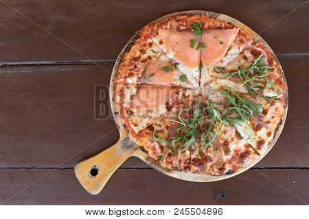 Delicious Baked Italian Salmon Pizza On The Wooden Table