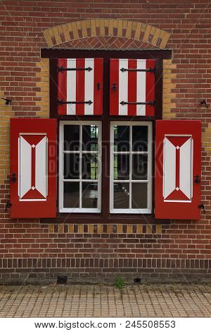 Red And White Decorations On The Doors And Window Shutters Of De Haar Castle. The Colors Are Derived
