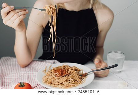 Young Attractive Beautiful Girl Woman Eating Italian Food A Plate Of Pasta With Sugo, Lifestyle. Ita