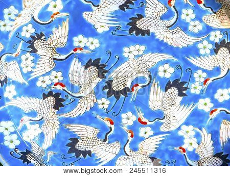 Beijing, China - November 13, 2017 Old Chinese Design Blue White Red Cranes Ceramic Plate  Panjuan F