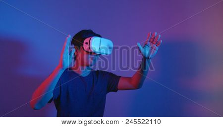 Man playing with virtual reality device 