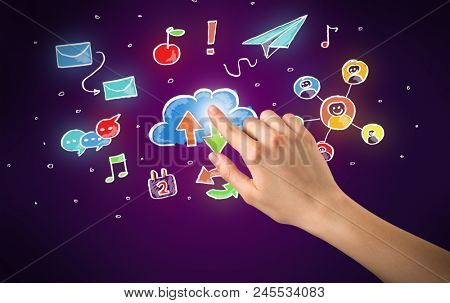 Female hand toucing mixed media icons with purple background