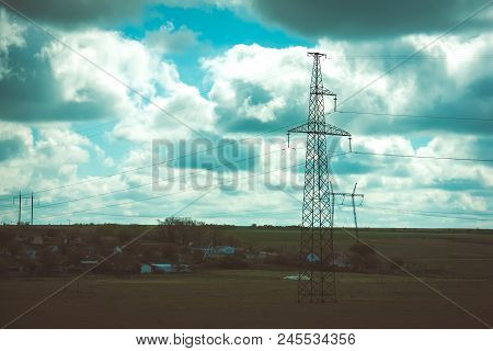 High-voltage Transmission Lines In The Summer Landscape, Color Photo, Selective Focus