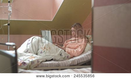 Woman Using Laptop In Hospital Bed. Professional Shot In 4k