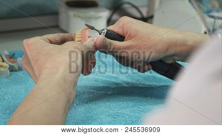 Dental Technician Making Deture Prothese. Close Up. Professional Shot In
