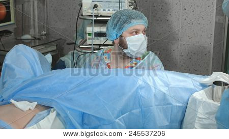 Doctor Looking At The Display During Endoscopy Surgery. Close Up