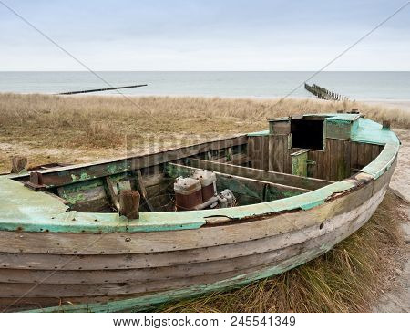 Fishermens Boat At Seacoast, On Sand At Sunset With Horizon Sea On Background. Background Of Sea Wit