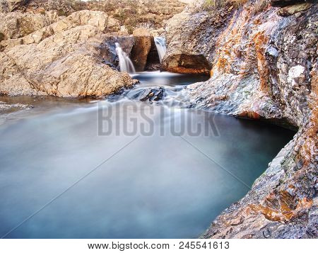 Multiple Waterfalls, Seemingly Vibrant Blue And  Green In Color, With Cold Swimmable Pools. Popolar 