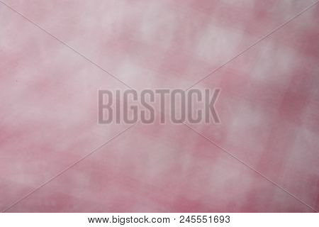 A Multicolored Decorative Abstract Blurry Background. Grayish Red Tones
