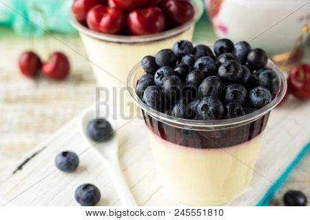 Italian Dessert Pana Cota With Berry Jam And Fresh Blueberries