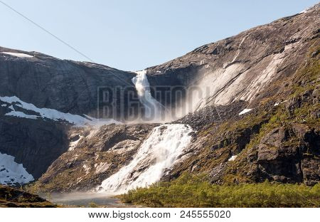 Photo Of Rapid Stunning Waterfall In Husedalen Valley, Norway. Aerial View. Summer Time.