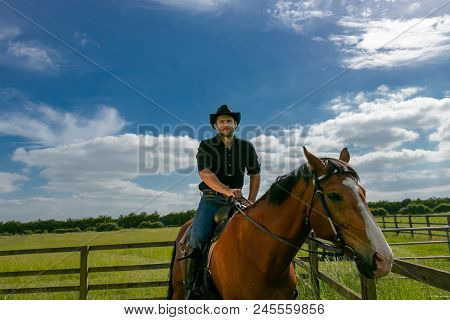 Good Looking, Hunky Cowboy Riding Horse With Boots, Chequered Shirt And Hat